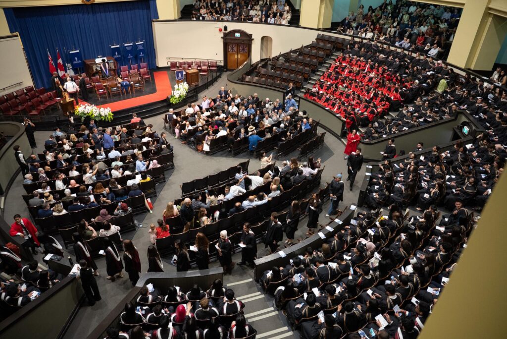 convocation hall receiving graduation attendees